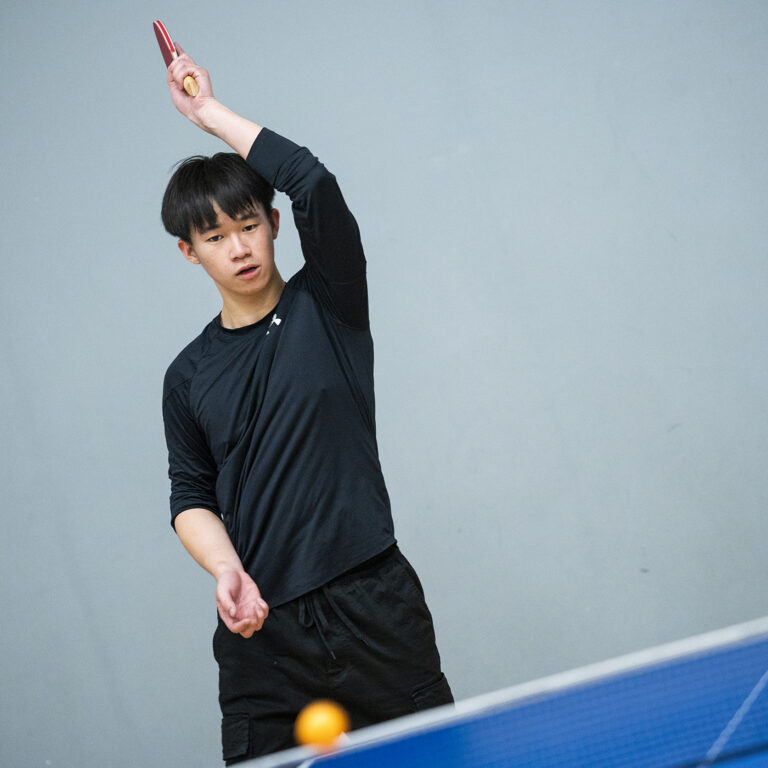 student playing table tennis